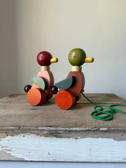 Colourful vintage pull-along ducks
