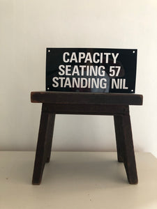 Vintage ‘Seating Capacity' sign