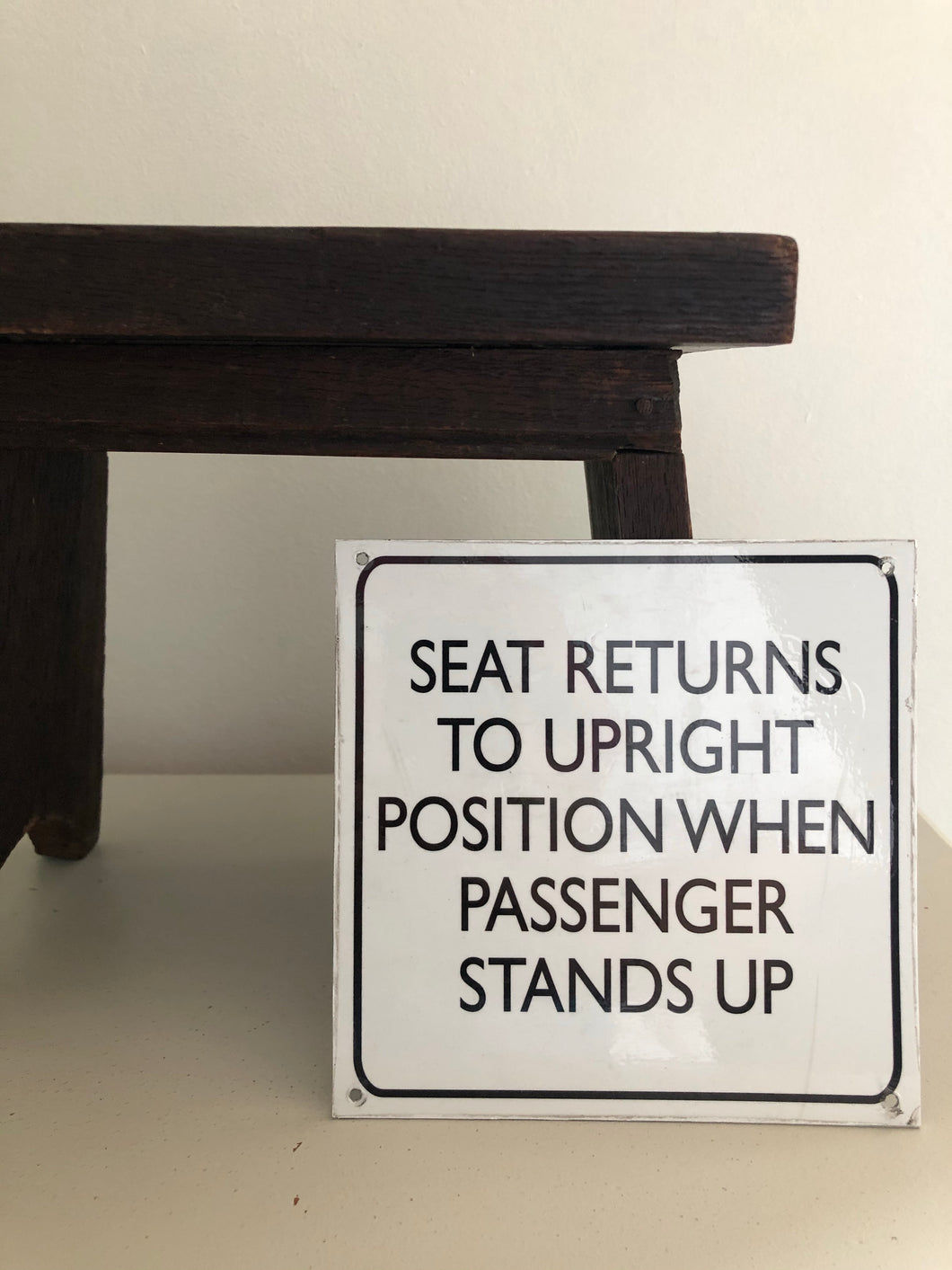 Vintage ‘Seat Returns Upright' sign