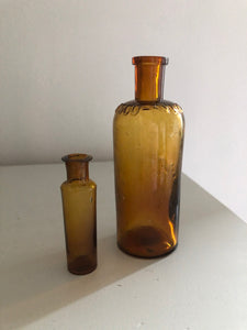 Pair of Vintage Amber glass Bottles