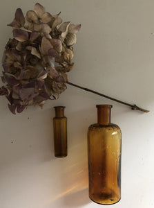 Pair of Vintage Amber glass Bottles