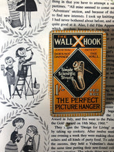 Load image into Gallery viewer, Vintage ‘Wall Hook’ orange tin